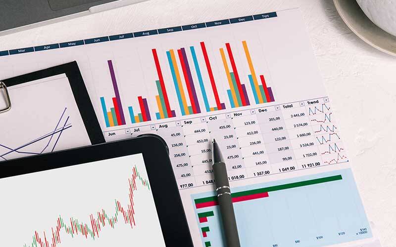 Picture of charts and information on paper and on the screen of a tablet computer
