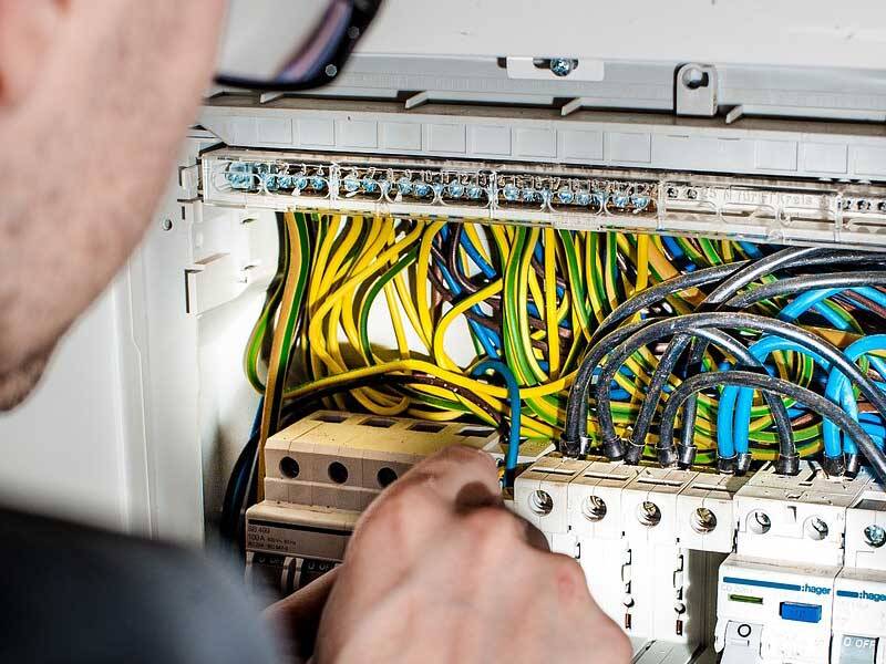 Contractor working at electrial distribution board