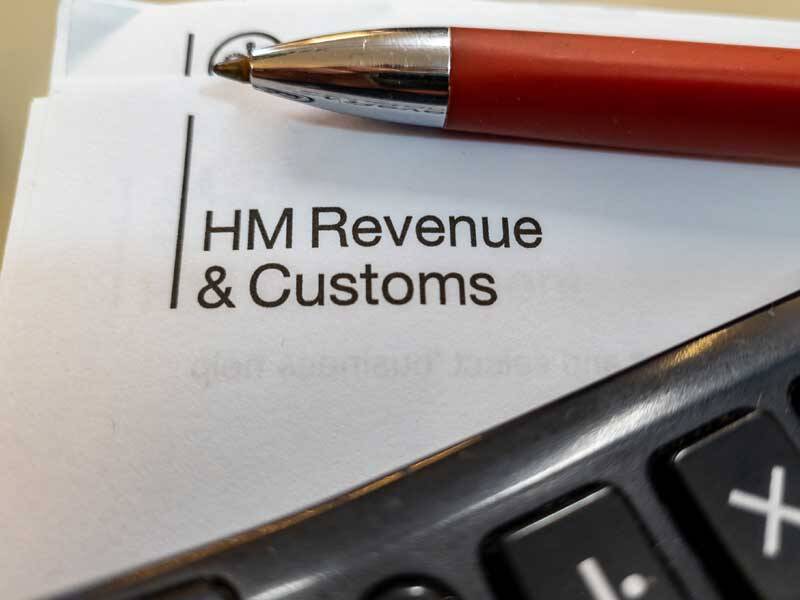 Pen and paper showing HMRC concerning tax advisory services in London