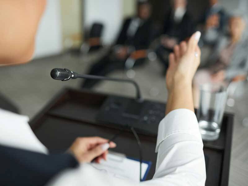 Business man standing at podium