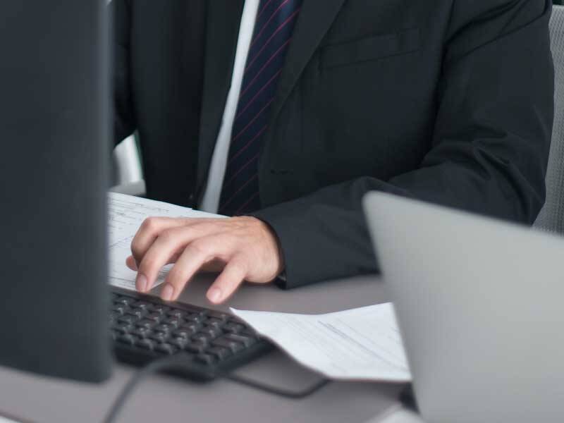 Business man using a desktop computer
